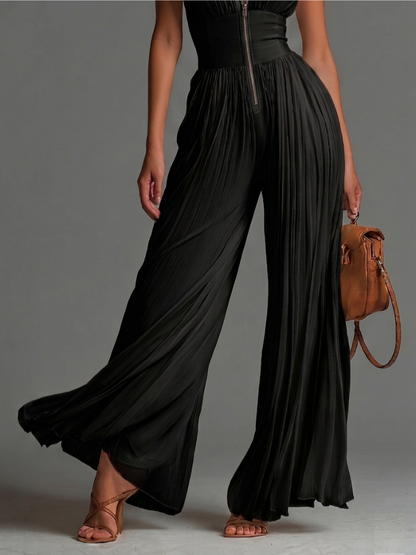 Íris Essência – Macacão Preto de Chiffon Plissado